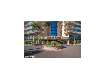 Regency Towers building with elegant entrance, landscaping, and architectural details at 3111 Bel Air Dr # 6E, Las Vegas, NV 89109