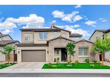 Charming two-story home featuring a stone facade, desert landscaping, and a spacious two-car garage at 350 Gandara St, Las Vegas, NV 89138
