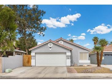 Well maintained single-story home features a two-car garage, and desert landscaping at 5937 Round Castle St, Las Vegas, NV 89130