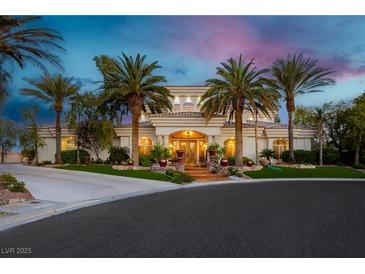 Elegant estate boasting lush landscaping and mature palm trees at 7625 Coley Ave, Las Vegas, NV 89117