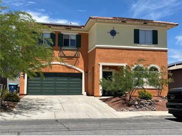 Charming two-story home features a two-car garage and stucco exterior with beautiful landscaping at 7920 Aviano Pines Ave, Las Vegas, NV 89129