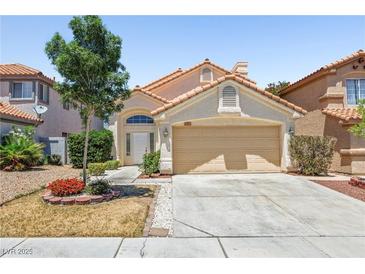 Charming single-story home featuring a well-maintained front yard and an attached two-car garage at 9520 Rancho Palmas Dr, Las Vegas, NV 89117