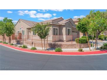Charming single-story home with a well-maintained front yard and red sidewalk border at 329 Gemstone Hill Ave, North Las Vegas, NV 89031