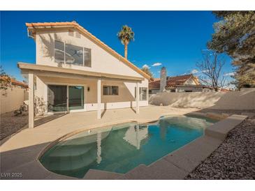 Sparkling pool with patio offers a private outdoor oasis, perfect for relaxation and entertaining at 4669 Winfield Dr, Las Vegas, NV 89147