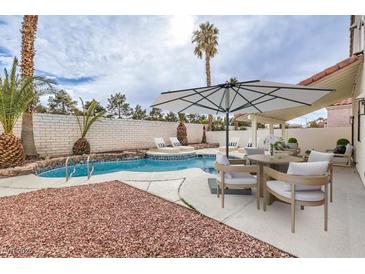 Beautiful backyard pool and patio area, perfect for outdoor entertaining and relaxation at 6 Megan Dr, Henderson, NV 89074