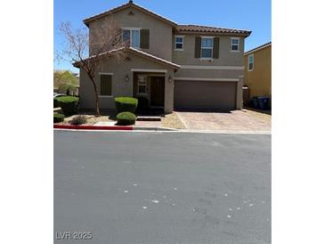 Charming two-story home features a well-manicured lawn and a two car garage at 3855 Park Field Dr, Las Vegas, NV 89120