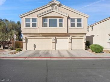 A charming two-story home with a three-car garage and beautiful desert landscaping at 4830 Double Down Dr # 102, Las Vegas, NV 89122