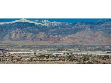 Wide shot of Las Vegas buildings and homes with scenic mountain range backdrop on a clear day at 8255 S Las Vegas Blvd # 2004, Las Vegas, NV 89123