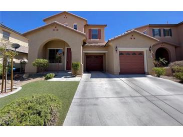 Charming two-story home with a well-manicured lawn, two-car garage, and beautiful archway entry, great curb appeal at 11237 Newbury Hills Ave, Las Vegas, NV 89138