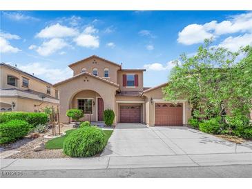 Charming two-story home with two-car garage, inviting entry and manicured landscaping at 11237 Newbury Hills Ave, Las Vegas, NV 89138