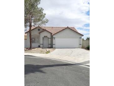 Charming single-story home featuring a two-car garage and a well-maintained front yard at 2721 Coffee Pot Ct, Las Vegas, NV 89106