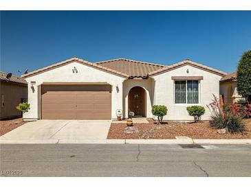 Charming single-story home with a desert-landscaped front yard and two-car garage at 4410 S Gressa St, Pahrump, NV 89061