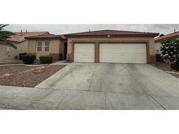 Charming single-story home with two-car garage and well-maintained landscaping at 5318 Rio Eldorado Ct, North Las Vegas, NV 89031