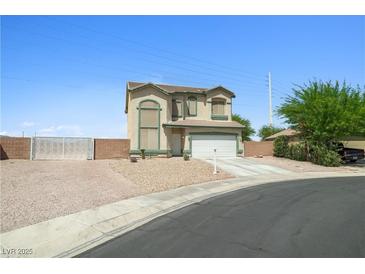 Two-story home with desert landscaping, two-car garage, and low-maintenance yard at 6088 Gulf Island Ave, Las Vegas, NV 89156