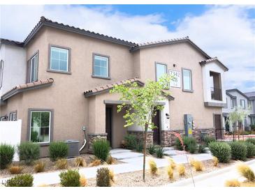 Attractive two-story townhome showcasing desert landscaping and a private entrance at 7342 N Decatur Blvd # 5, Las Vegas, NV 89131