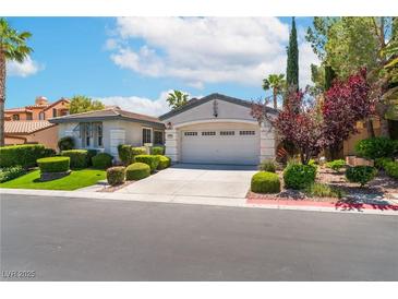 Charming single-story home featuring a two-car garage and beautifully landscaped front yard at 11405 Perugino Dr, Las Vegas, NV 89138