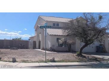 Charming two-story home features a tile roof and well-manicured landscaping at 2147 Bridle Wreath Ln, Las Vegas, NV 89156