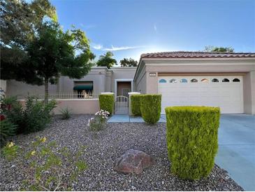 Charming single-story home with a well-manicured front yard and desert landscaping at 2343 Scotch Lake St, Las Vegas, NV 89134