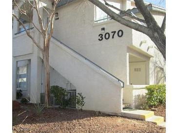 Inviting condo exterior featuring a private entrance and well-maintained landscaping at 3070 Tarpon Dr # 102, Las Vegas, NV 89120