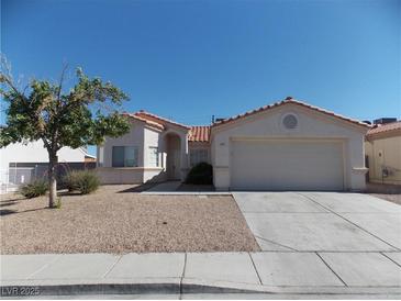 Charming single-story home featuring a low maintenance desert landscaped front yard at 319 Mulberry Glen Dr, North Las Vegas, NV 89031
