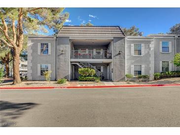 Attractive two-story condo with stucco exterior and balcony entrance in a well-kept community at 3823 S Maryland Pkwy # P1, Las Vegas, NV 89119