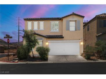 Charming two-story home with a well-manicured front yard and attached two-car garage in a desirable neighborhood at 5695 Merced St, Las Vegas, NV 89148