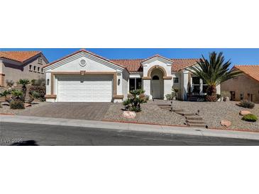 Charming single-story home featuring a well-maintained lawn and a two-car garage at 10100 Folsom Dr, Las Vegas, NV 89134