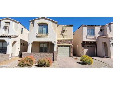 Charming two-story townhome featuring desert landscaping and an attached one car garage at 10230 Viterbo St, Las Vegas, NV 89183