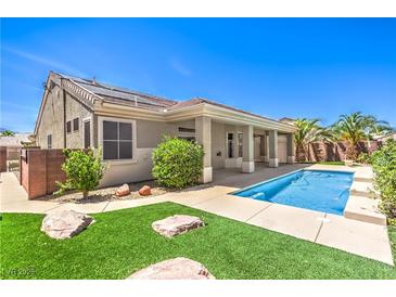 A private backyard pool with well manicured landscaping and desert-friendly rock features at 2158 High Mesa Dr, Henderson, NV 89012