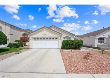 Charming single-story home featuring a well-maintained front yard and a two-car garage at 4336 Desert Dancer Way, Las Vegas, NV 89147