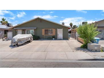 Charming single-story home with large driveway, mature landscaping, and neutral color scheme at 4565 Halbert Ave, Las Vegas, NV 89110