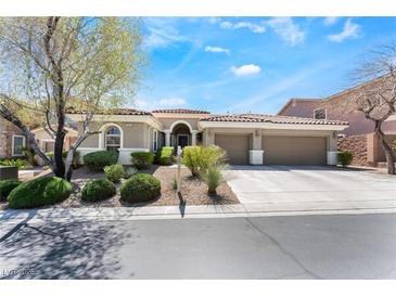Charming single-story home with a three-car garage and well-manicured landscaping in a quiet neighborhood at 7567 Desertscape Ave, Las Vegas, NV 89178