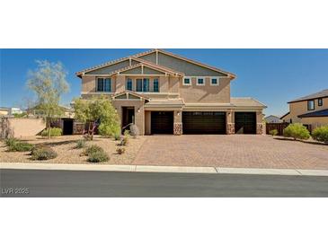 Beautiful two-story home showcasing a three-car garage and a well-maintained desert landscape at 7572 Mount Spokane Ct, Las Vegas, NV 89113
