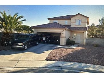 Two-story home featuring desert landscaping, and an attached two-car garage at 6024 Ripple Cloud Ct, North Las Vegas, NV 89031