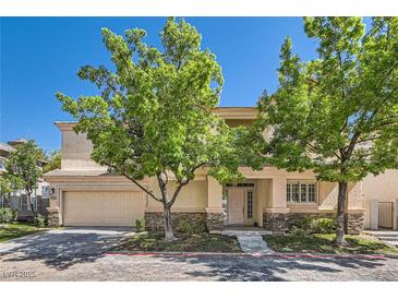 Charming two-story home with a two-car garage and mature trees at 8040 Arcadian Ln, Las Vegas, NV 89147