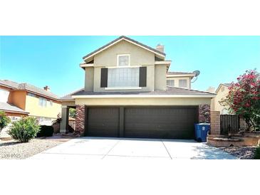 Two-story home with a three-car garage and well-maintained landscaping at 8397 San Ramon Dr, Las Vegas, NV 89147