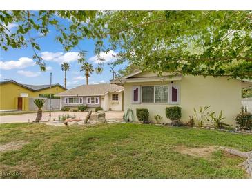 Charming single-story home with a well-maintained lawn and classic desert landscaping at 2706 Colanthe Ave, Las Vegas, NV 89102