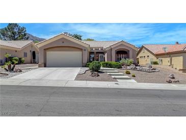 Charming single-story home with a two-car garage, desert landscaping, and a welcoming entrance at 2805 Hanging Rock Dr, Las Vegas, NV 89134