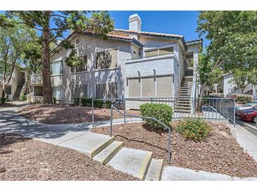 Charming two-story condo with mature trees and landscaped grounds in a residential community at 5241 Caspian Springs Dr # 203, Las Vegas, NV 89120