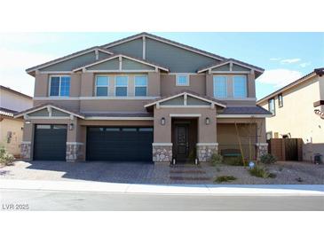 Beautiful two-story home featuring a two-car garage and welcoming front porch at 7855 Skyler Falls Ln, North Las Vegas, NV 89084