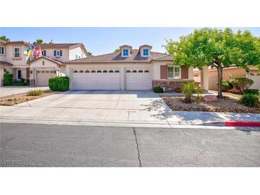 Charming single-story home featuring a two-car garage and well-manicured landscaping at 270 New River Cir, Henderson, NV 89052