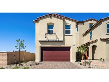 Stylish two-story home featuring desert landscaping, a brick driveway and a two car garage at 340 Taylor St, Henderson, NV 89015