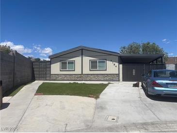 Charming single-story home with a well-manicured front yard and a covered parking area at 4184 Lady Lucille Ct, Las Vegas, NV 89115