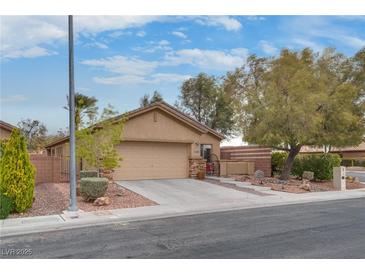 Charming single story home with a well-manicured front yard and two car garage in a quiet neighborhood at 4204 Sprints Race Ave, North Las Vegas, NV 89084