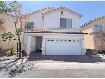 Charming two-story home with a well-maintained front yard and two car garage at 7371 Catmint St, Las Vegas, NV 89113