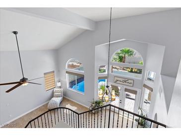 Bright entryway boasts large windows, high ceilings, a ceiling fan, and tile flooring at 9417 Grenville Ave, Las Vegas, NV 89134