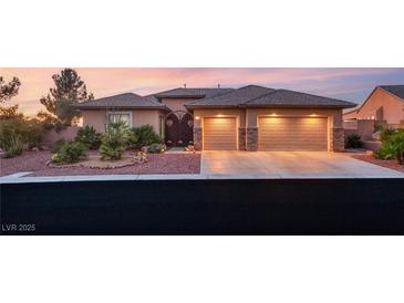 Charming single-story home featuring a well-manicured front yard, desert landscaping and a two-car garage at 20 Kittansett Loop, Henderson, NV 89052