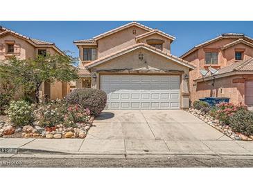 Charming two-story home with well-manicured landscaping and a two-car garage in a suburban neighborhood at 4832 Englewood Ave, Las Vegas, NV 89139