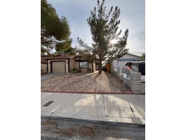 Cozy single-story home featuring a low-maintenance rock yard and an attached one-car garage at 542 Grimsby Ave, Henderson, NV 89014