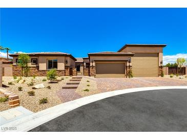 Charming single-story home with a two-car garage, landscaped front yard, and desert-friendly landscaping at 5739 Christian Creek Ct, Las Vegas, NV 89149